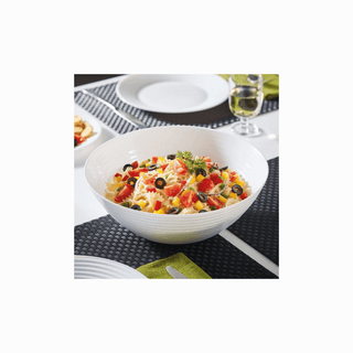 Saladeira Harena com frutas cortadas, em ambiente de cozinha.